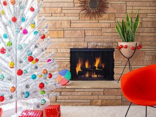 Aluminum Christmas trees featured alongside a mid mod fireplace and eclectic bullet planter.