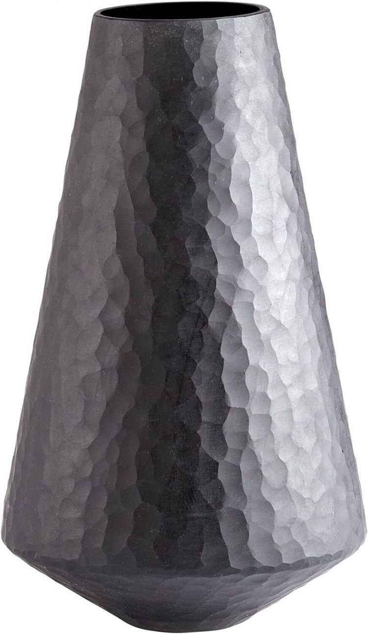 Bed and bath lava vase with abstract geometric design.