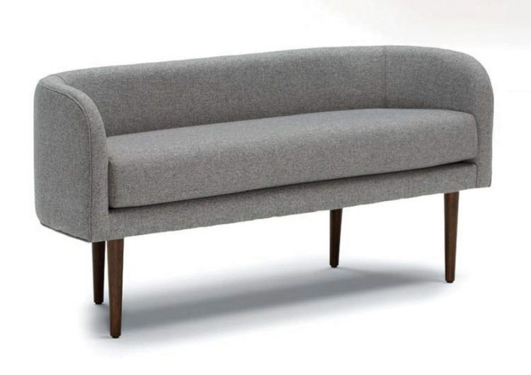 A bench with a curved symmetry and gray color scheme.