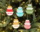 modern ornaments in the shape of vintage pyrex bowls hanging on a christmas tree