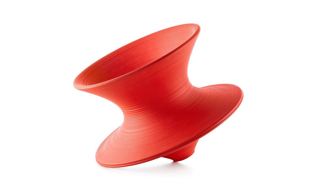 red Herman Miller Spin chair swirling top- like outdoor patio chair