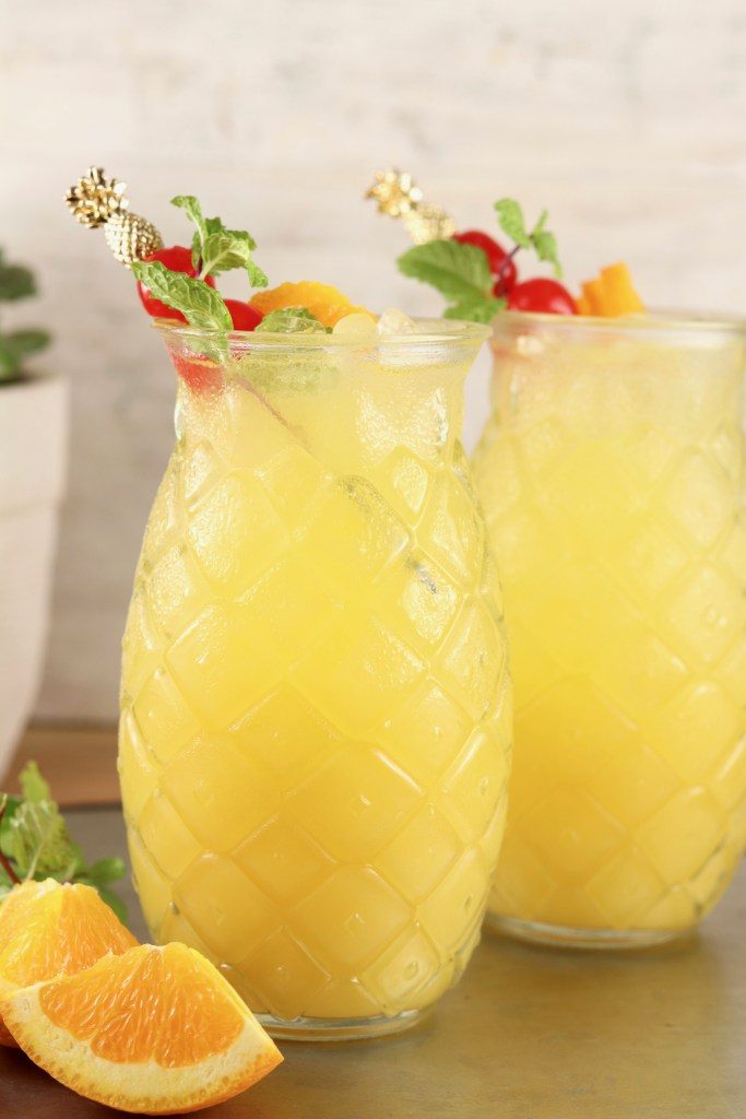 Pineapple screwdriver in pineapple glasses with garnish