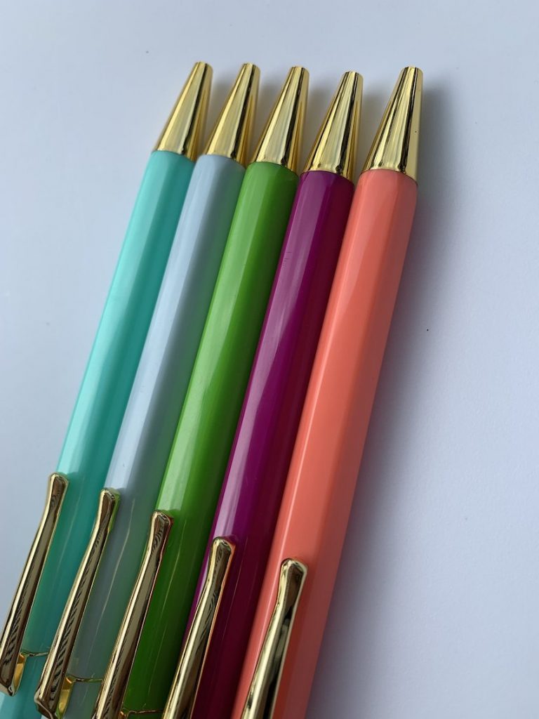 5 pens in different candy shades of blue, green, purple and pink, with gold tips.
