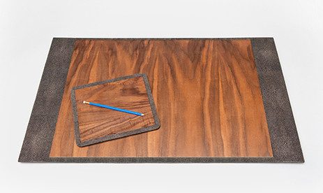 mid mod office supplies: A small wood veneer mouse pad sits on top of a large rectangular desk blotter with wood veneer.>