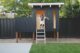 Eichler siding adds MCM period style to this retro-inspired playhouse.