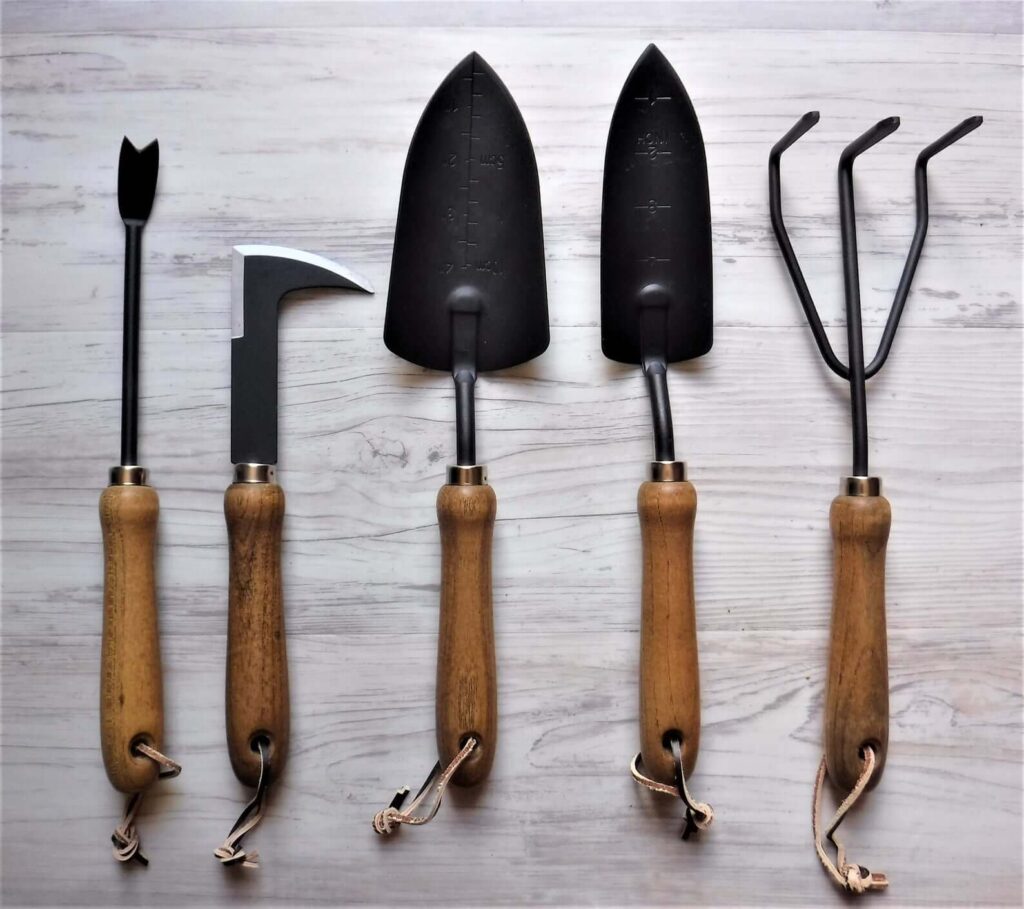 Black and wood MCM outdoor gardening tools