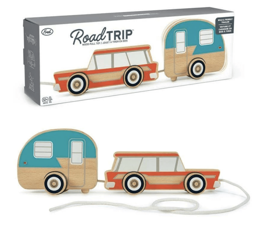Retro blue camper pull toy with a red car