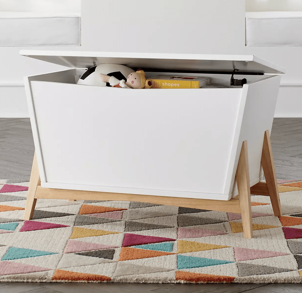 White and wood Mid Century Modern toy chest for a playroom
