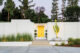 Philmer J. Ellerbroek architectural home with yellow door and white brick