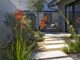 mid century modern drought-tolerant backyard with rectangular pavers