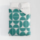 MCM summer bedding with large teal and white geometric pattern 