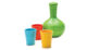 Red, yellow and blue tumblers with a green water carafe