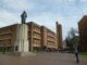 View of Odegaard Undergraduate Library past statue of George Washington at Red Square