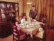 family at Thanksgiving table mid century