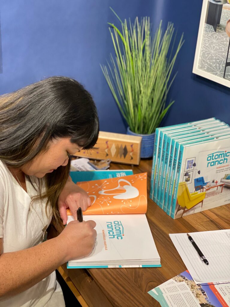 Jickie Torres signs Atomic Ranch book at booth