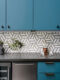 Christine Turknett designed kitchen blue cabinets geometric backsplash
