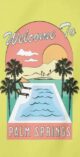 Yellow "Welcome to Palm Springs" beach towel with pool and palm tree design
