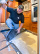 Man Revealing concrete floor