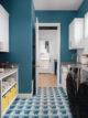 laundry room with dark blue walls