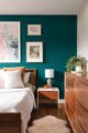 bedroom with teal accent wall in 1959 Denver home