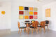renovated dining room with multi color art gallery wall
