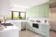 modern kitchen with mint green cabinets