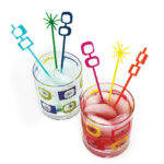 MCM liquor glasses with stir sticks.