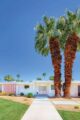 Twin Palms home exterior white with pink accents