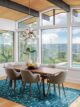 open floorplan dining room with a view teal modern rug