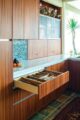 Kitchen with waffle glass and appliance bay