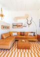 The orange living room in Dani Nagel's Krisel home
