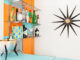 MCM bar setup with starburst clock and orange and teal checkered wall