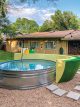 DIY stock tank pool in Mid-Century Millennial's backyard