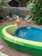 backyard stock tank pool with avocado slice perimeter