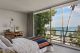 Bedroom in Pierre Koenig Beagles house with wall windows in view of ocean