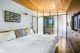 bedroom with cedar ceiling, retractable wall