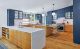 open concept kitchen with blue cabinetry in Maryland mid century home