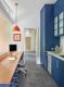 home office and butler's pantry with blue cabinetry and orange pendant light