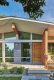 mid century home front exterior entryway with wood cedar siding