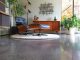 finished concrete flooring and eames lounge chair