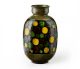 Bitossi Cerchi vase black background with yellow and green dots