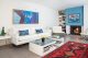 modern redesign showcases art in living room with fireplace