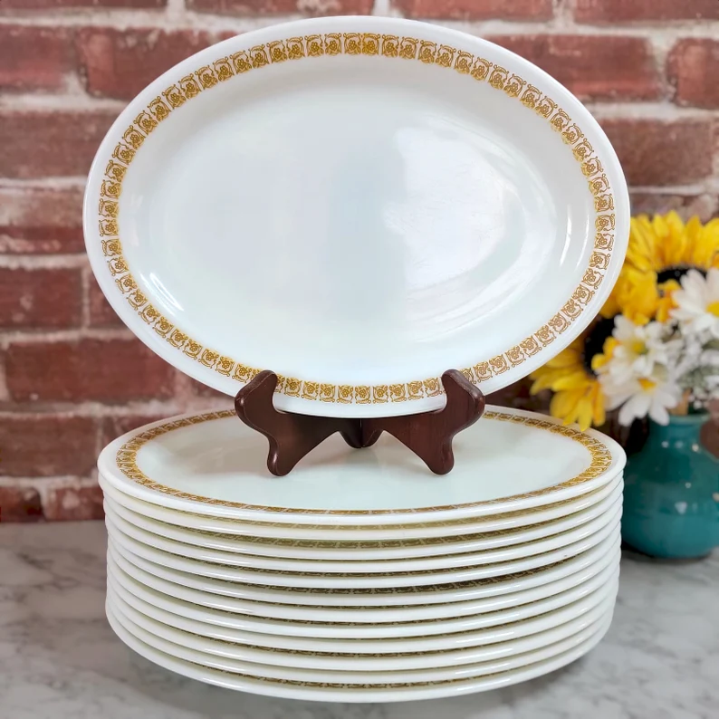 1970s Pyrex Brand Tableware by Corning, thick and heavy duty 12.25" x 9" large oval dinner plate
-Each plate features a golden brown flower/scroll design known as "Tiburon"
