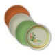 a set of orange, white, green and ringed deco reusable plates. 