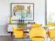 yellow Saarinen dining chairs in vibrant Michigan home MCM credenza
