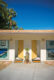 two yellow doors lead to the backyard of the Old Las Palmas home