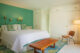 green accent wall in bedroom of restored Old Las Palmas home