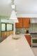 restored kitchen in 1950s Old Las Palmas home with colorful geometric backsplash