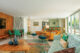 wide angle view of Old Las Palmas restored 1950s home green dining chairs and star