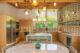 brass finishes and tile walls in remodeled kitchen